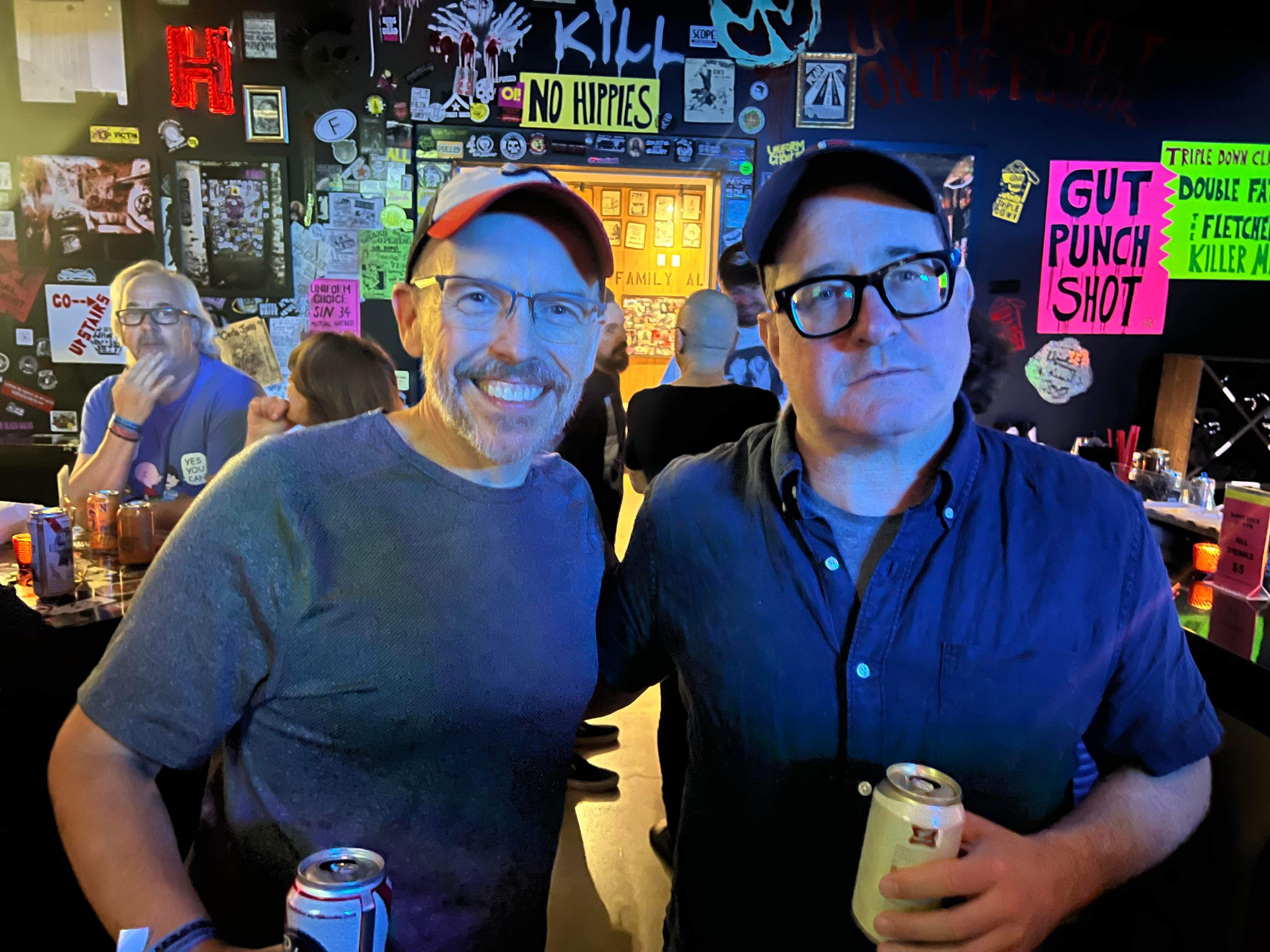 Lee Clontz and Craig Finn standing together in a bar